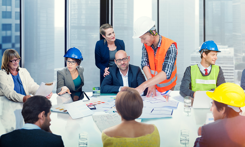 Diverse group discussing building plans