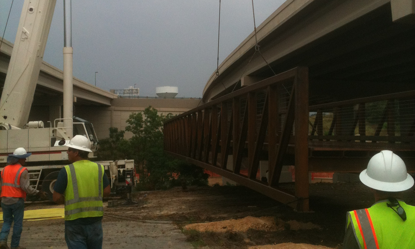 Construction workers installing a bridge