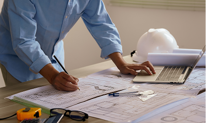 Designer planning construction project with laptop