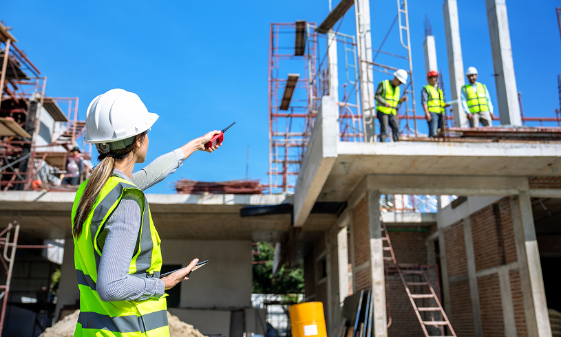 Building under construction with team guidance