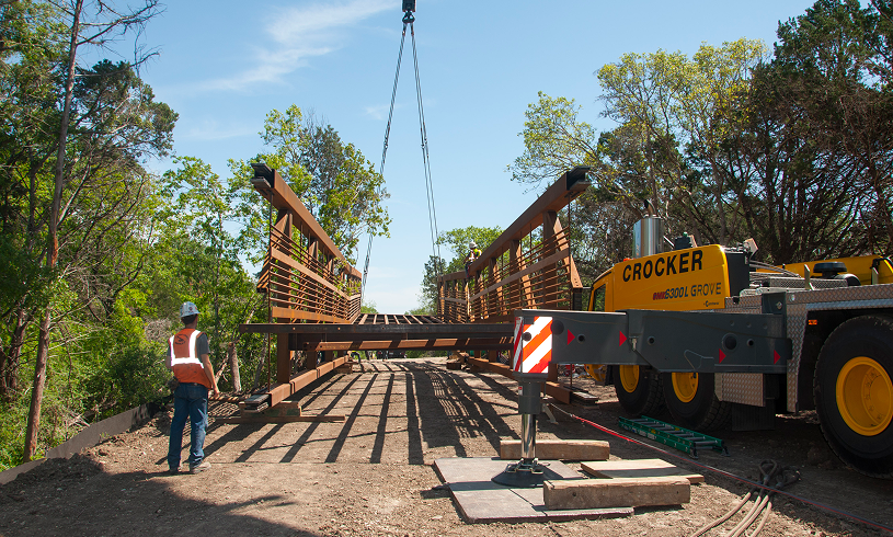 Construction worker overseeing bridge installation