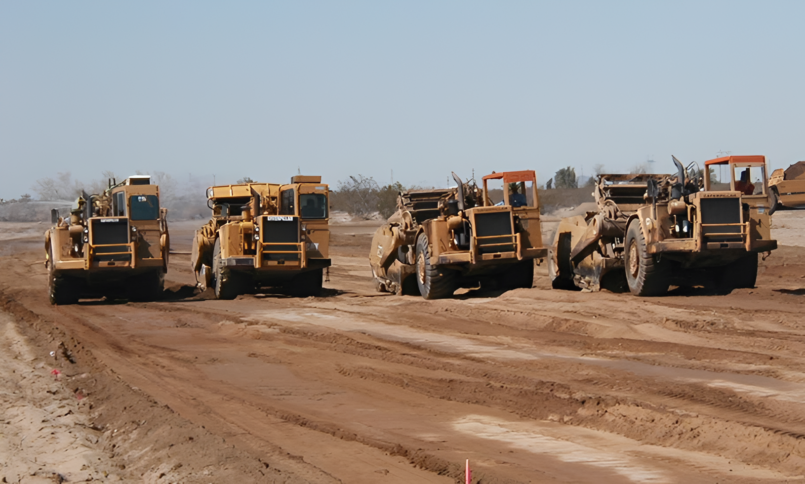 Construction vehicles on a dirt road