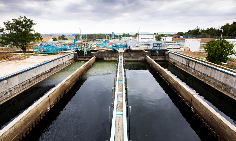 Water treatment facility with tanks and equipment.