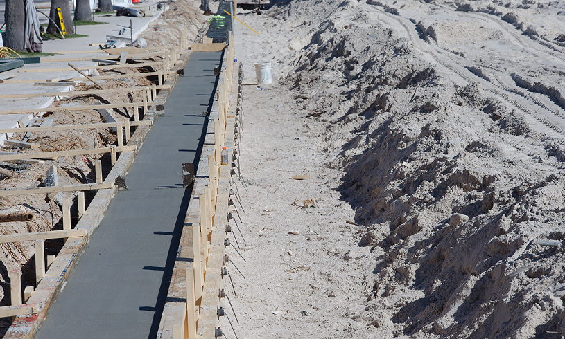 Freshly poured concrete sidewalk construction