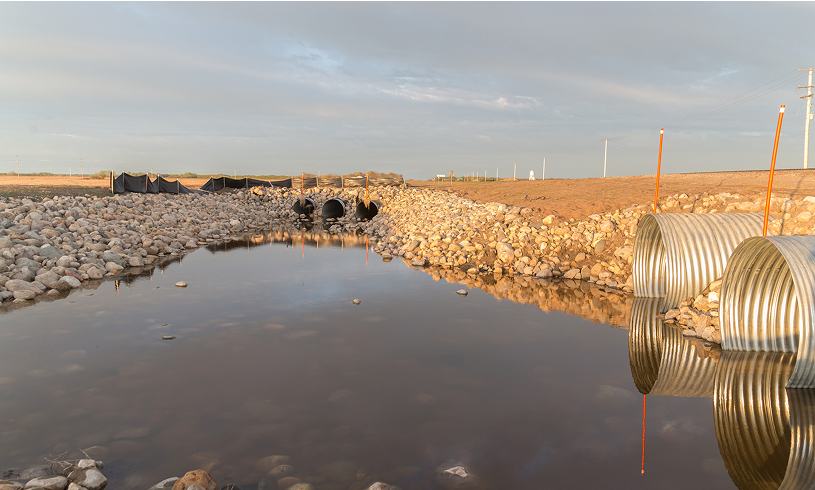 Rural landscape with drainage pipes
