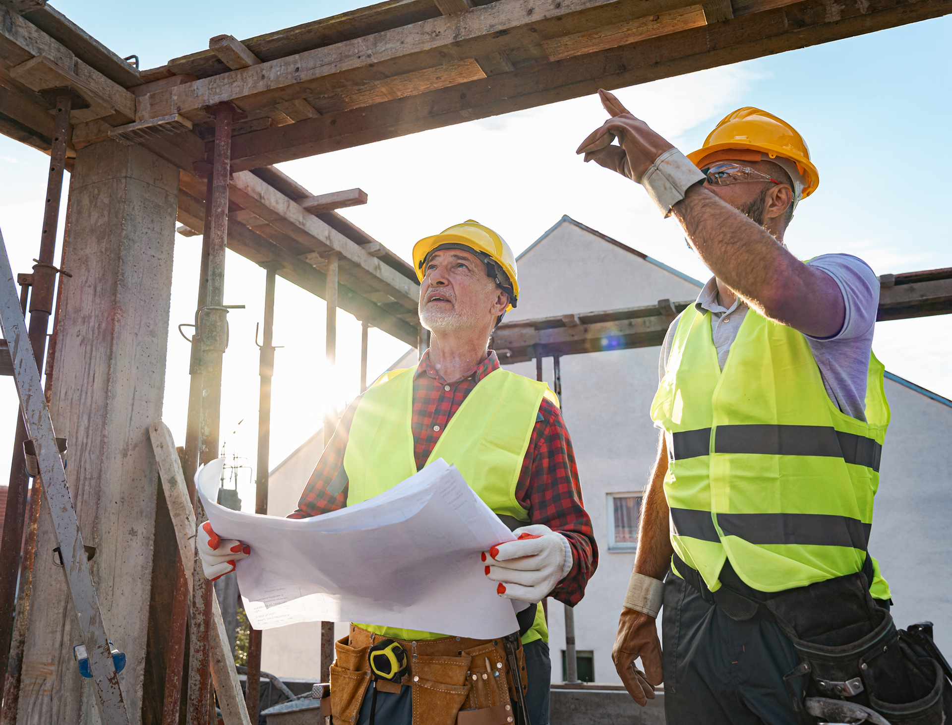 Workers in safety gear at construction site
