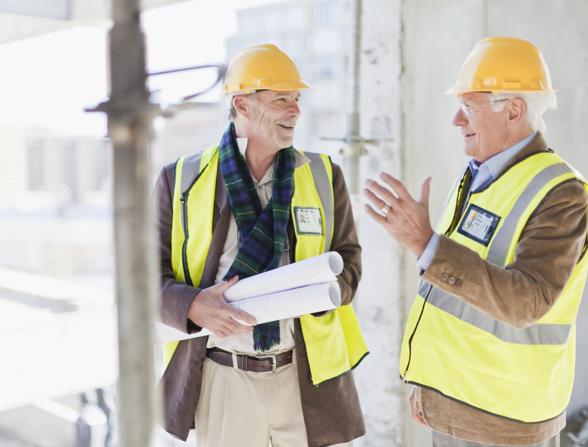 Two men reviewing building plans