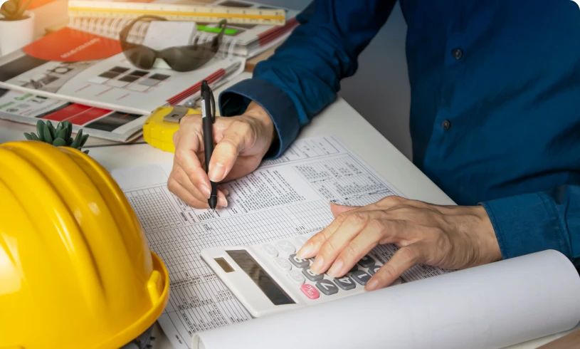 Construction planning with helmet and documents