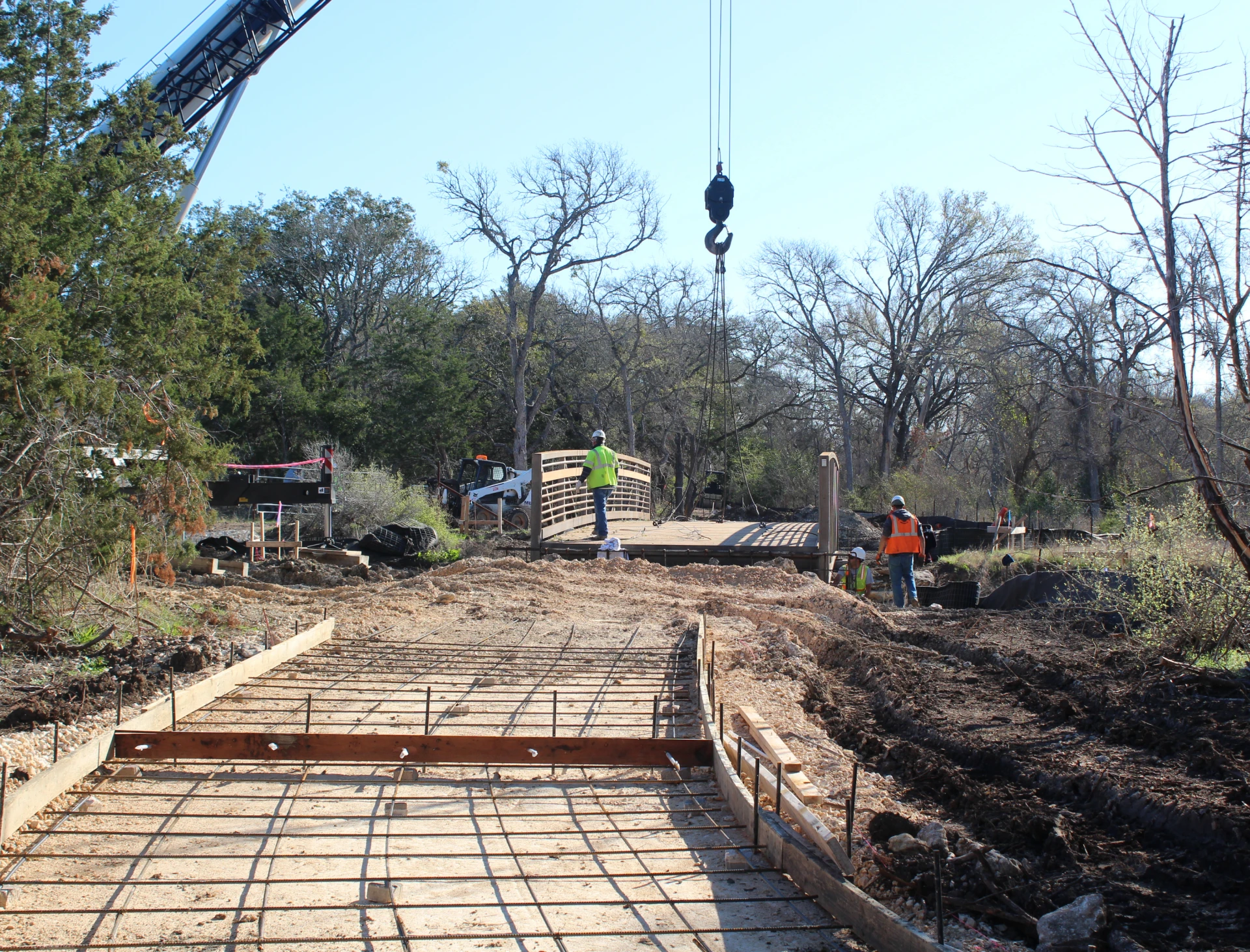 Crane lifting materials at construction site